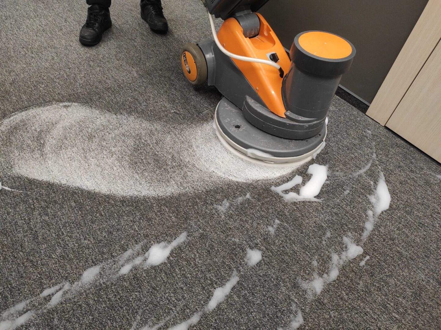 Carpet cleaning with a rotary floor machine.