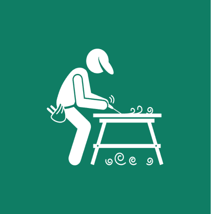 Person woodworking at a table illustration.
